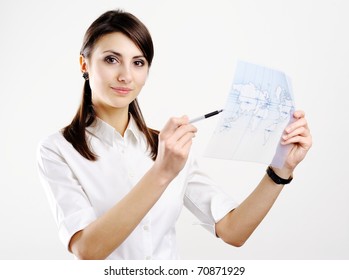 A girl holding a map of the world printed on a transparent material