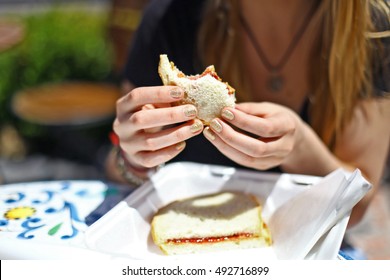 Girl Holding Peanut Butter And Jelly Sandwich PBJ