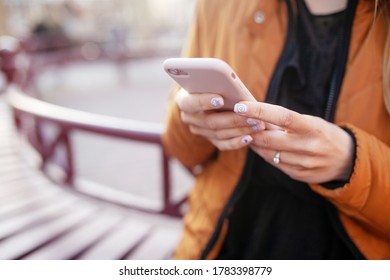 Girl holding phone in hands. Close up picture - Shutterstock ID 1783398779