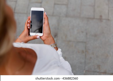 Girl Holding A Phone In His Hand