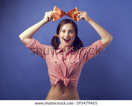 girl holding pizza
