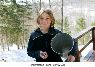 Girl Holding A Sap Bucket And Spigot For Making Maple Syrup