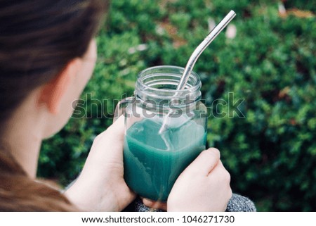 Girl Holding a Smoothie