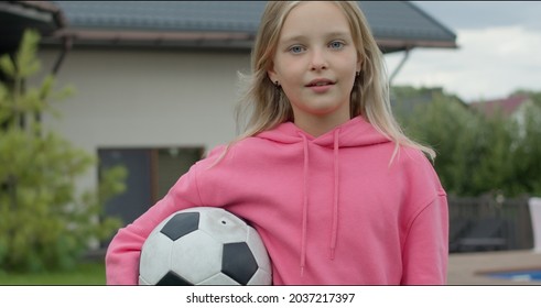 Girl Holding A Soccer Ball