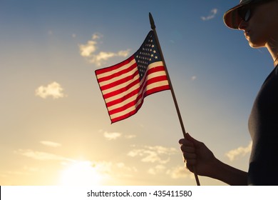 Girl Holding USA Flag.