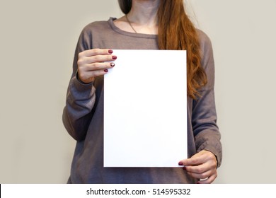 Girl Holding White A4 Blank Paper Vertically. Leaflet Presentation. Pamphlet Hold Hands. Woman Show Clear Offset Paper. Booklet Design Sheet Display Read First Person.