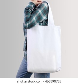 Girl Is Holding White Blank Cotton Tote Bag, Design Mockup.