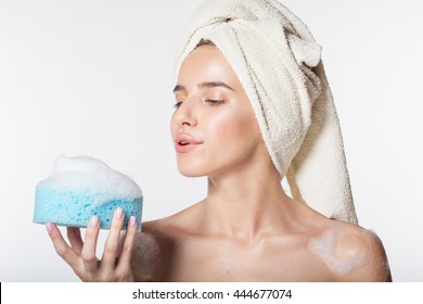 Girl is holding wisp with white foam