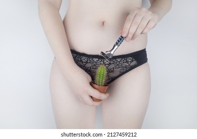 The Girl Holds A Cactus In Front Of Her Pubis. Symbol Of Stubble And Problems With Home Depilation. Razor Near Excess Hair. Body Positivity And Body Hair Problems.