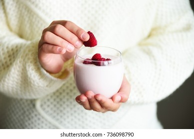Girl Holds Glass Of Milk Or Yogurt, Kefir With Raspberries. Healthy And Clean Eating. Copy Space. Breakfast, Snack. Lifestyle Concept