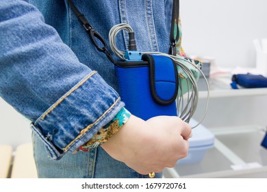 A Girl Holds Halter To Monitor The ECG Of The Heart In The Cardiology Clinic. Close-up