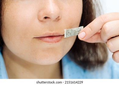 The Girl Holds In Her Hands A Pillow Snbcha Nicotine Pouch.