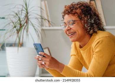 girl at home with mobile phone or smartphone - Powered by Shutterstock