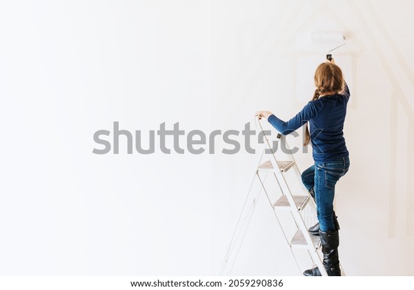 Girl home painting\
for interior renovation