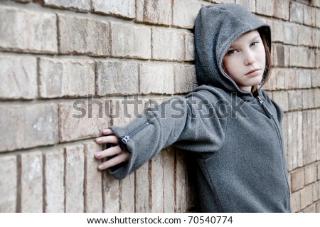 girl in hooded jacket outside