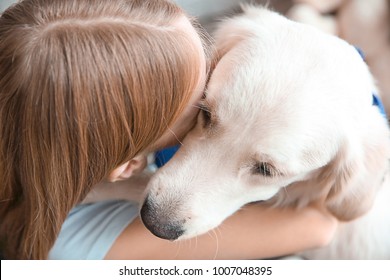 Girl Hugging Golden Retriever, Closeup. Service Dog