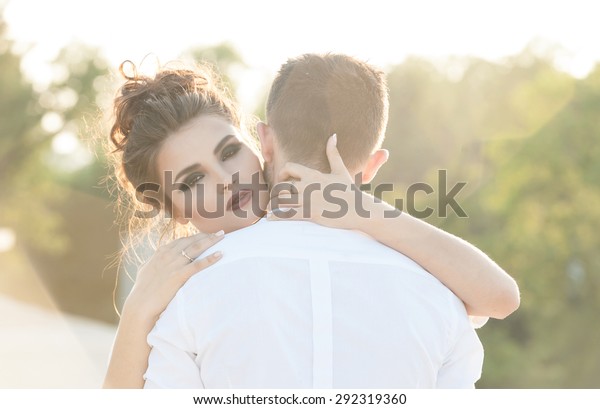 Girl Hugging Her Boyfriend Strong Back Stock Photo 292319360 | Shutterstock