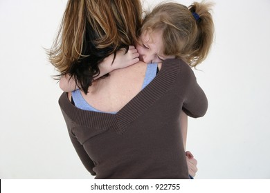 Girl hugging her mom.