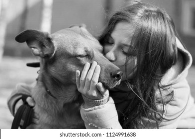 Girl Hugging Kissing Dog Closing Eyes Cute Lovely Black And White Friendly Pet Closeup Big Dog