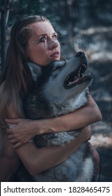 A Girl Hugging A Wolf