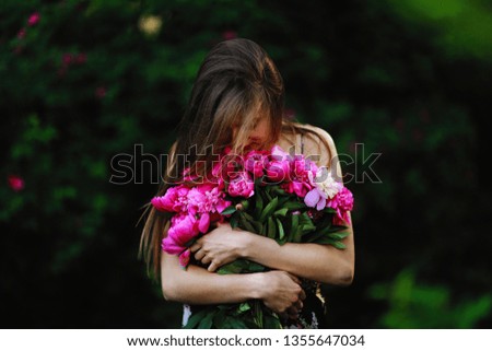 Similar – Woman arranges luxury bouquet of flowers