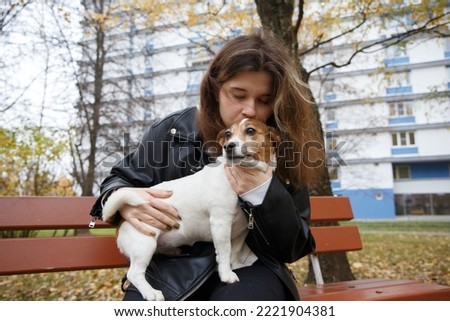 Similar – Portrait of a young, tall woman behind a blond Labrador