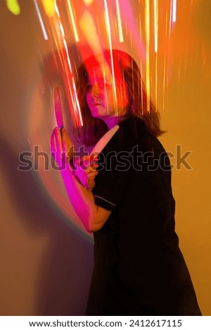 Similar – Long exposure at night of a woman waving her hands. What a pity that you stop here!