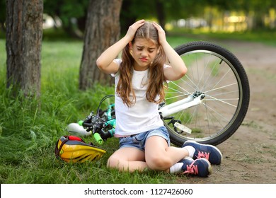 The girl was injured while riding a bike in the summer.