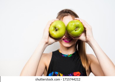 The Girl Jokes And Put Two Green Apples To Her Face Instead Of Her Eyes.
Healthy Food. Vegan Lifestyle.