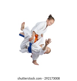 Girl In Judogi Is Doing Judo Throw  