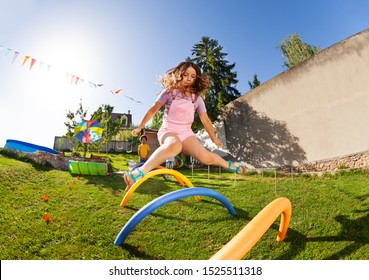 Girl jump high pass many barriers in competition - Powered by Shutterstock