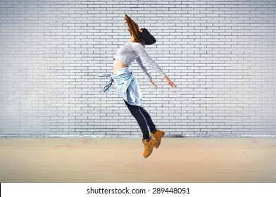 Girl jumping in hip hop style - Shutterstock ID 289448051