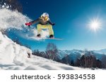 Girl is jumping with snowboard from the hill