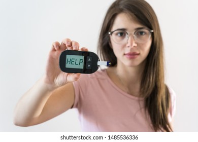 Girl With Juvenile Diabetes Shows Glucometer Asking For Help Because The Blood Sugar Is High