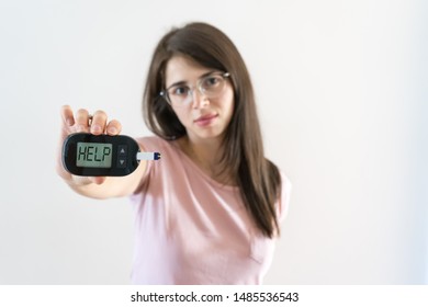 Girl With Juvenile Diabetes Shows Glucometer Asking For Help Because The Blood Sugar Is High