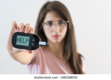 Girl With Juvenile Diabetes Shows Glucosometer Asking For Help Because The Blood Sugar Is High