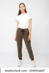 girl in khaki sweatpants and a t-shirt