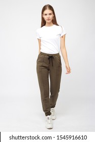 Girl In Khaki Sweatpants And A T-shirt