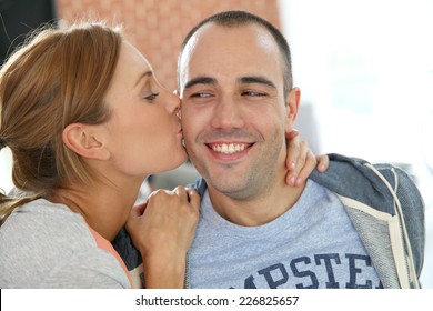 Girl Kissing Boyfriend On Cheek