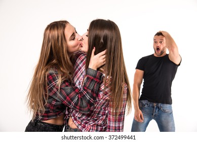 The Girl Kissing A Girl. Man In Shock.