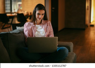 Girl With A Laptop In Her Lap. Woman On The Couch Watching Shows On Her Laptop. Teen Video Calling Her Friends.