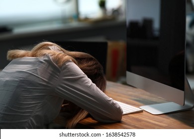 Girl Lay On Table In Office And Turned Off Monitor. Sedentary Lifestyle Carries Load On Spine, Impaired Circulation. Woman Used Limited Supply Mental Energy. Woman Sat Up At Work Until Evening.