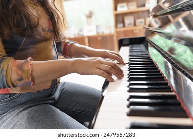 Girl learn to play piano. woman hand playing piano  - Powered by Shutterstock