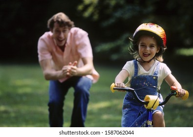 Girl Learning To Ride Bike