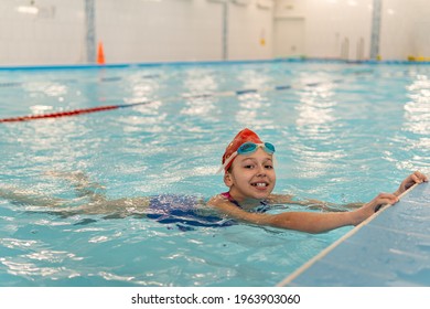 Girl Learning To Swim. Sports And Entertainment For Children. Swimming Competition. Healthy Lifestyle From Childhood