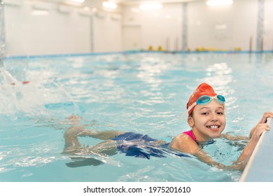 Girl Learning To Swim. Sports And Entertainment For Children. Swimming Competition. Healthy Lifestyle From Childhood