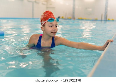 Girl Learning To Swim. Sports And Entertainment For Children. Swimming Competition. Healthy Lifestyle From Childhood