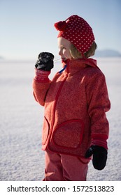 Girl Licking Icicle In Snow