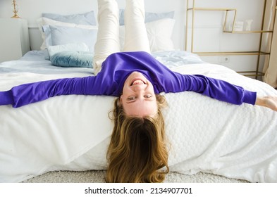 619 Young girl upside down on bed Images, Stock Photos & Vectors ...