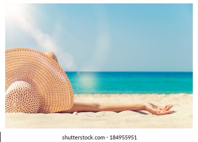 girl lies on the white sand on the beach